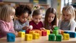 © Sarawut - Preschoolers stacking colorful blocks during therapy, showing teamwork and focus, educators assisting, inclusive and joyful environment