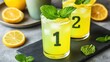 © PStyle - Two glasses of refreshing lemon drink with mint leaves, numbered 1 and 2, served on a slate, surrounded by lemon slices.
