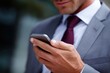 © Chandlerlikes - Businessman using smartphone for remote communication