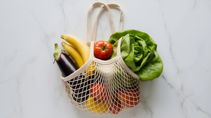 A reusable net bag filled with fresh produce including bananas tomato lettuce and eggplant on marble 100