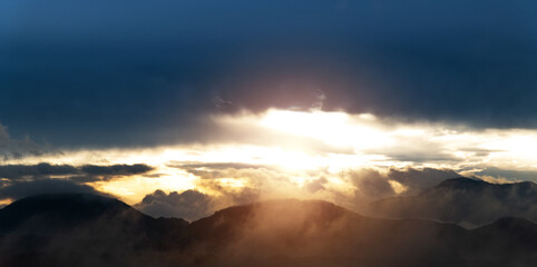 Wall Mural - the sun rises from the mountainside