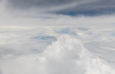 Wall Mural - looking at the clouds and sky on the plane
