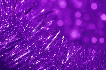 Wall Mural - close-up of purple-illuminated silver christmas tinsel