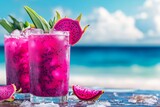 Vibrant pink drinks with dragon fruit garnishes on a beach background.