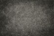 © AkuAku - Rugged and gritty concrete floor with a dark, distressed finish as a textured backdrop