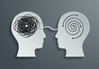 © Ozz - Two heads represent mental states, communication, and clarity in a visual metaphor.