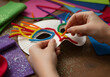 © Ramdhaniyah - Child crafting colorful mask project