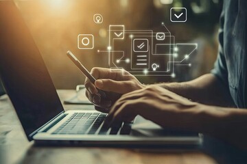 Person working on laptop and phone, digital interface overlay