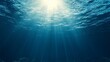 © Tharumina - Hyper-realistic underwater perspective looking up at the shimmering ocean surface, with sunlight rays penetrating the deep blue, symbolizing aquaphobia and the emotional fear of being submerged alone