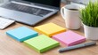 © Max - Organizing ideas with sticky notes on a desk home office highangle shot of memo creativity modern workspace strategic planning