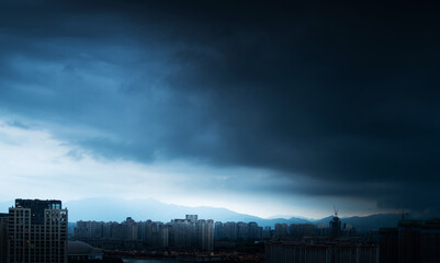 Wall Mural - City buildings under the storm clouds