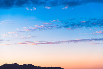 Wall Mural - background sunset sky and mountain silhouette
