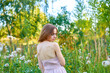 © SergeiPh - A beautiful woman stands in the forest on a summer day. A white dress and transparent panties are dressed on it. The scene is peaceful and serene when the girl is surrounded by nature