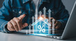 © mod - Person using laptop with house icon and upward arrows indicating property value increase trend online