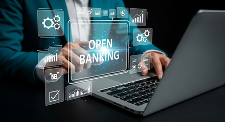 Person typing on a laptop with open banking interface and business icons overlayed on screen view