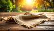© Arifalimantaka - sackcloth on the table with sunlight in the background
