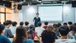 © Phoophinyo - Group of Asian university students listening to professor explaining lesson with whiteboard and projector screen in background, academic atmosphere