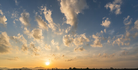Wall Mural - sunset sky clouds in the evening summer with orange, yellow sunlight in golden hour or morning sunri