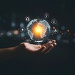 © Ayat - Hand holding a glowing digital earth with sustainability icons and bokeh background