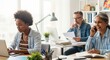 © Arclens Studio - Working Together: Capture an open-plan office setting featuring colleagues collaborating and focusing on diverse work activities, showing productivity, technology use, and workplace culture.