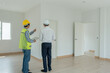 © Shisu_ka - inspector engineer and owner project is inspecting construction and quality assurance new house. Engineers or architects or contactor work to build the house before handing it over to the homeowner