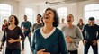 © mcjanuald - A joyful and diverse group of people laughing heartily together during a therapeutic laughter yoga class in a bright wellness workshop studio