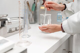 Close up of Pharmacist or scientist making medicine in laboratory using laboratory equipment