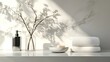 © dreamer - Minimalist bathroom setup featuring white towels, a glass vase with delicate white flowers, a soap dish with soap, and a metallic dispenser on a clean surface.
