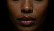 © Mirrorstudio - Close-up of african descent female lips and nose in shadow