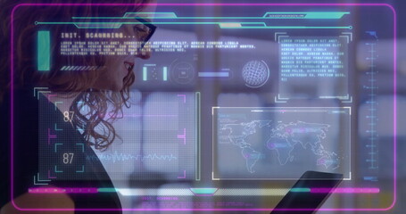 Wall Mural - using tablet with image overlay, person viewing data and world map