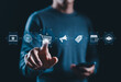 © Supatman - Online Shopping and E-commerce Technology Concept. Man interacts with icons representing online shopping, marketing, discount, ecommerce, retail industry, business strategy, modern consumer engagement