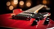© Farhan - Close-up of a glossy red electric guitar's body, strings, and controls, bathed in soft, warm, blurred bokeh lights, creating an inviting and intimate musical atmosphere.