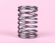 © Ytalo - Resilient Spiral: A close-up studio shot showcases a metallic spring, symbolizing durability and the essence of mechanical engineering.