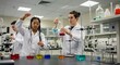 © AI Stock - Students in lab coats mixing colorful liquids in science laboratory