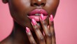 © miss irine - Close-up of female face with pink nail manicure. Pink gel polish on nails. Woman touches her lips. Beauty, fashion concept. Lips and nails. Beauty treatment at studio, cosmetics.