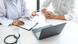 © Freedomz - Doctor consulting patient discussing something symptom of disease and recommend treatment methods, presenting results on report and prescription, Medicine and health care concept