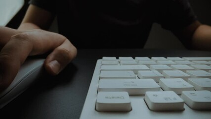 Wall Mural - close-up man typing on computer keyboard with hands and fingers. macro soft focus dolly shot. comput
