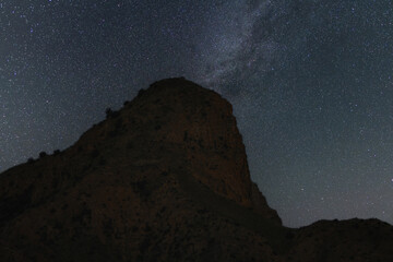Wall Mural - Beautiful night landscape , bright milky way galaxy over the mountain.