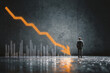 © mattegg - Businessman faces economic crisis downward market chart
