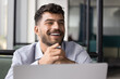 © fizkes - Happy moment of inspiration. Joyful candid gen z male student businessman freelancer enjoy result of remote work project on notebook screen look away with laughter excited by creative insight new idea