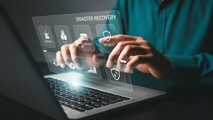 Man interacts with disaster recovery interface on laptop showing security and data icons