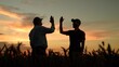 © Victoriia - Businessmen teamwork in field in agriculture. Farmers raise their hands, clap their hands, making deal, agricultural field. Teamwork of business people. Businessmen partners shaking hands in field
