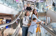 © Art_Photo - Asian family traveler on airport escalator, grandmother smiling with grandson, mother beside them on travel day, family package tour, airline service and health travel insurance, hotel accommodation