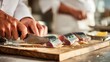 © Pannee - Preparing mackerel sashimi with precise knife cuts on a clean wooden board, highlighting professional culinary skills