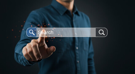Wall Mural - Man's Finger Touching Digital Search Bar on a Blue Shirt with Dark Background and Bright Interface