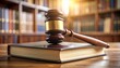 © SSuperTier - A close-up of a gavel resting on a law book in a courtroom setting.