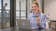 © stockbakers - Young Woman Enjoying Online Banking at Work, Online Shopping
