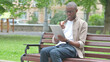 © stockbakers - Young African Man Video Calling or Conferencing on a Tablet