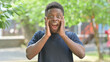 © stockbakers - Excited Casual African Man Feeling Surprised Outdoors