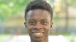 © stockbakers - Close-up of a Smiling Young African Man Face